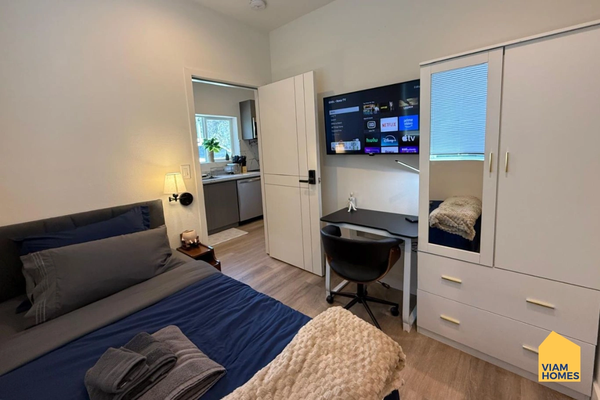 A bedroom in CONDO UNIT: SANTANA ROW 2B/2B by VIAM Homes