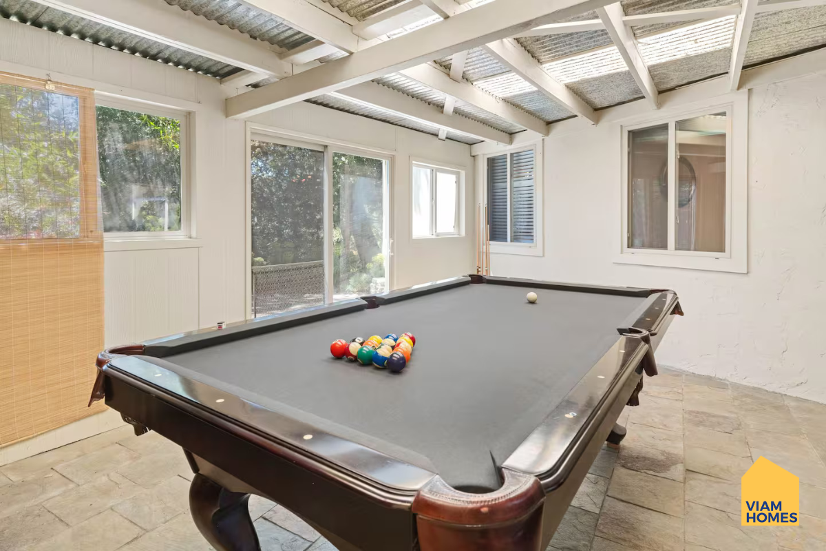 Pool table area at The Group Retreat Fleming Villa by VIAM Homes in San Jose