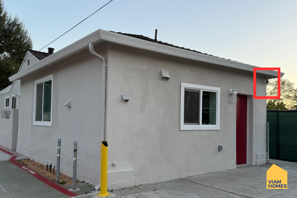 Cameras in outdoors areas in front of a furnished house by VIAM Homes