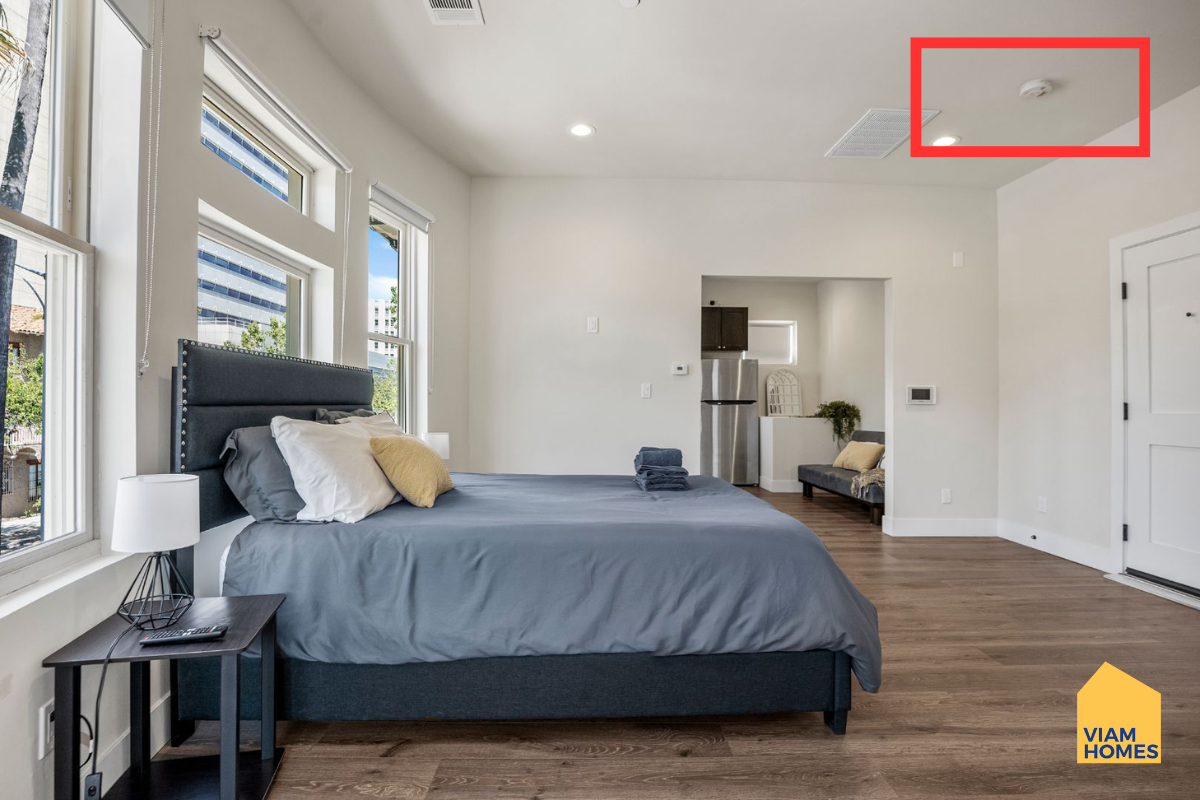 A typical fire alarm device in a furnished apartments by VIAM Homes