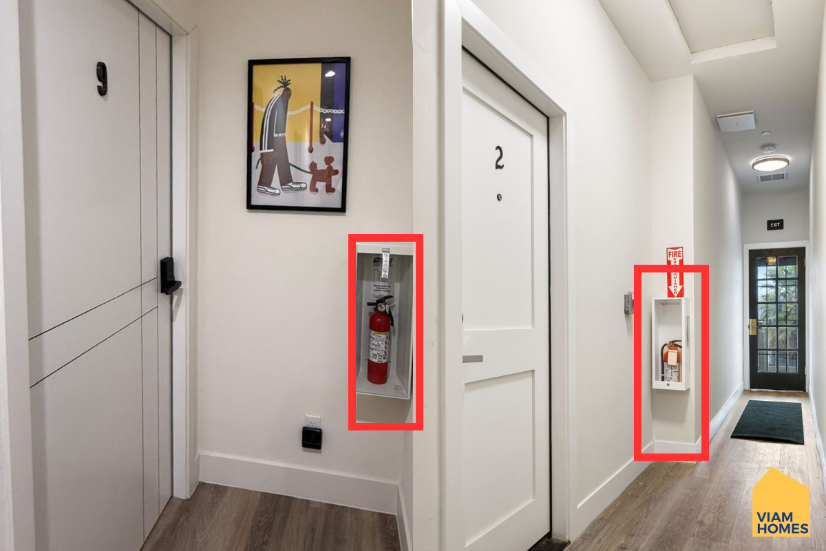 Fire extinguishers installed in the hallway of a furnished house by VIAM Homes