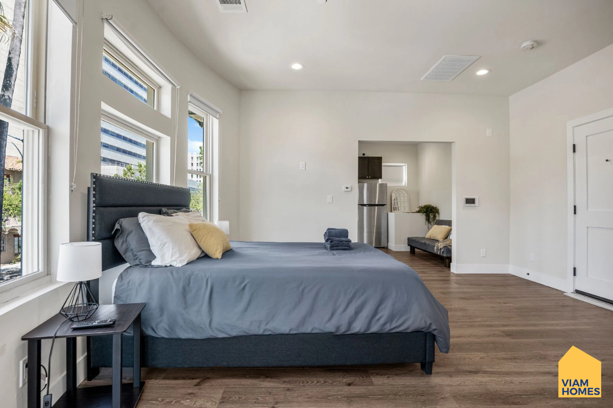 A furnished apartment with queen bed, en-suite bath, TV and dedicated workspace 